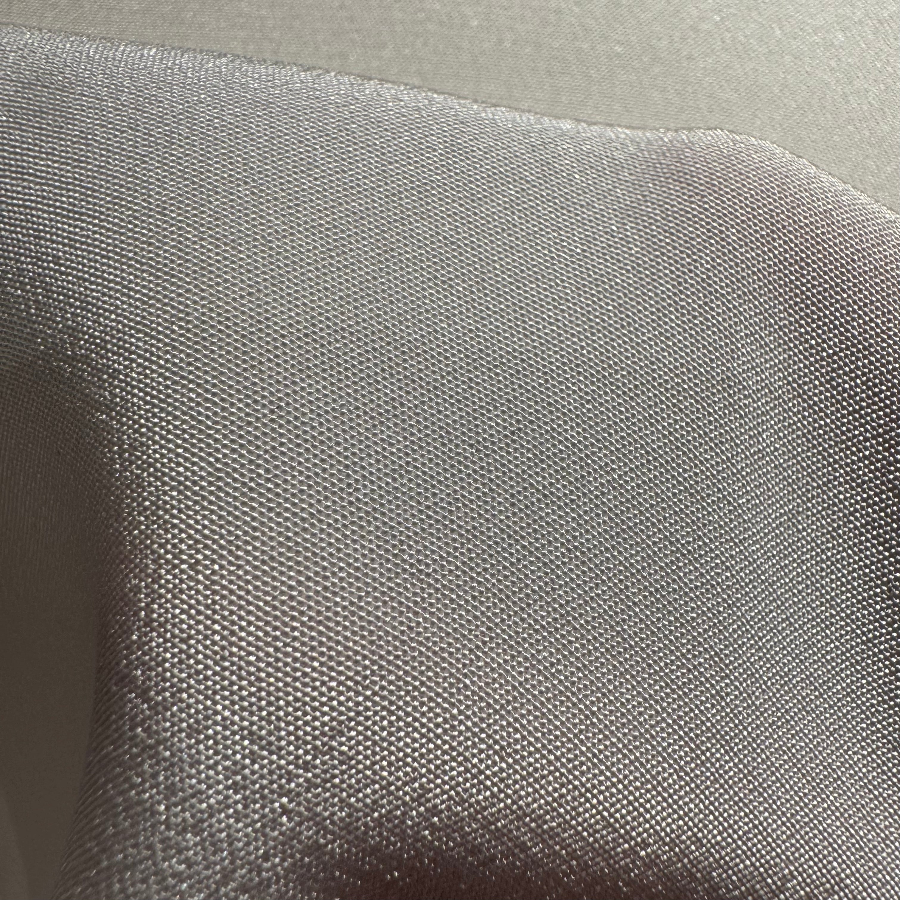 Close-up of off-white silk fabric crepe de chine texture