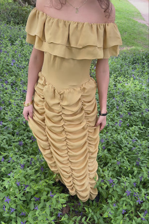 VKELLER Ruth Barley off-shoulder silk top and skirt, worn outdoors.