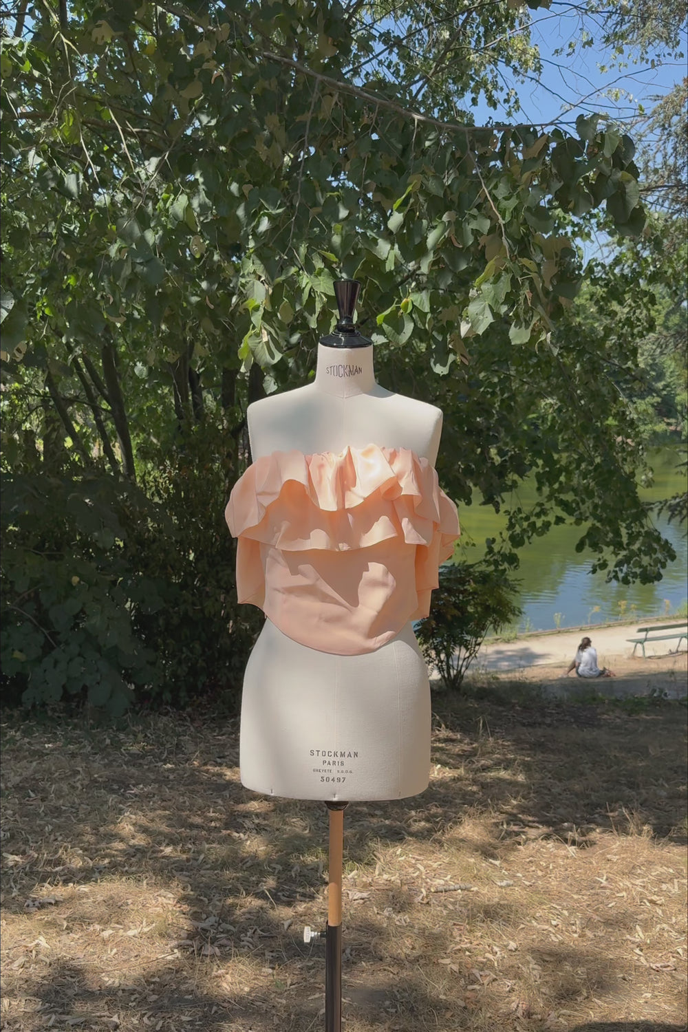 VKELLER Ruth peach off-shoulder ruffle silk top, shown outdoors.
