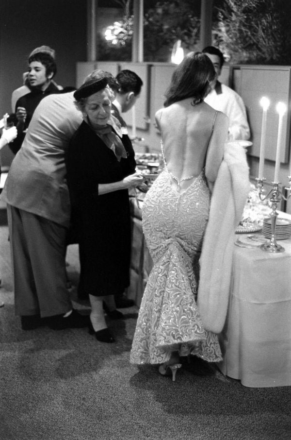 Vikki Dougan in the famous 1950s backless dress that inspired VKELLER's Vikki silk maxi dress — archival reference for the quiet-bohemian backless silhouette.