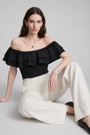 Ruth Top by VKELLER in Black Carbon. 100% silk off-shoulder top with gathered neckline and ruffled detail. Designed in Paris, handcrafted in Portugal. #carbon