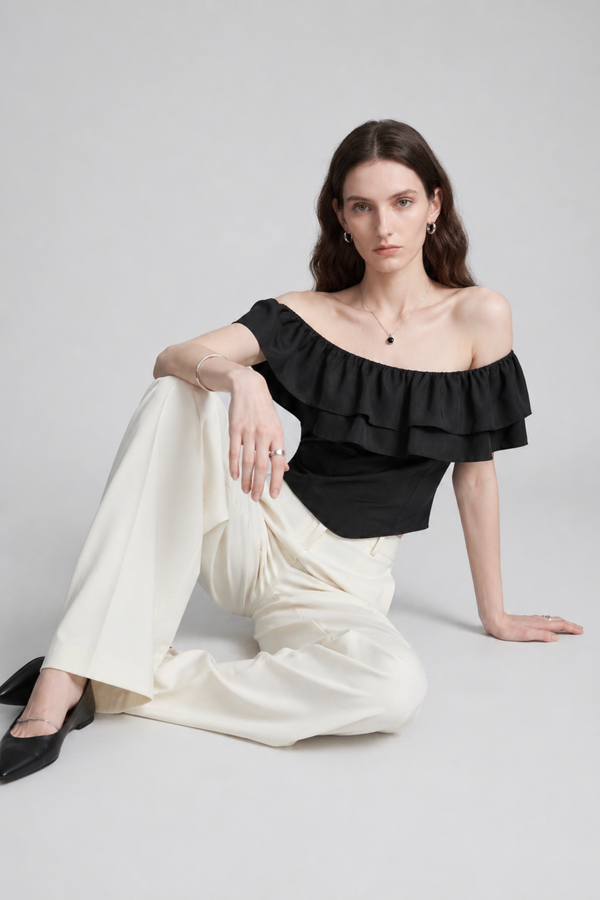 Ruth Top by VKELLER in Black Carbon. 100% silk off-shoulder top with gathered neckline and ruffled detail. Designed in Paris, handcrafted in Portugal. #carbon