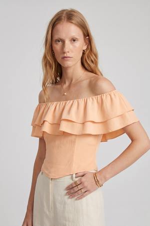 Ruth Top by VKELLER in Orange Peach. 100% silk off-shoulder top with gathered neckline and ruffled detail. Designed in Paris, handcrafted in Portugal. #peach