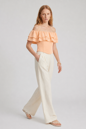 Ruth Top by VKELLER in Orange Peach. 100% silk off-shoulder top with gathered neckline and ruffled detail. Designed in Paris, handcrafted in Portugal. #peach