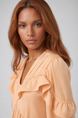 Samara Top by VKELLER in Orange Peach. 100% silk bohemian blouse with ruffled long sleeves and gathered neckline. Designed in Paris, handcrafted in Portugal. #peach