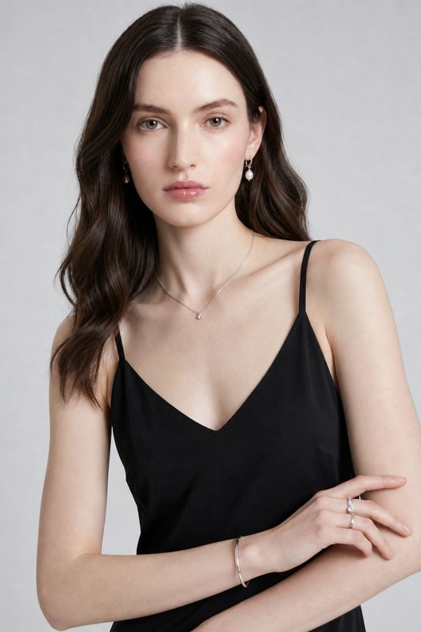 Vikki Maxi Dress by VKELLER in Black Carbon. 100% silk maxi dress with low back and flowing bias-cut silhouette. Designed in Paris, handcrafted in Portugal. #carbon