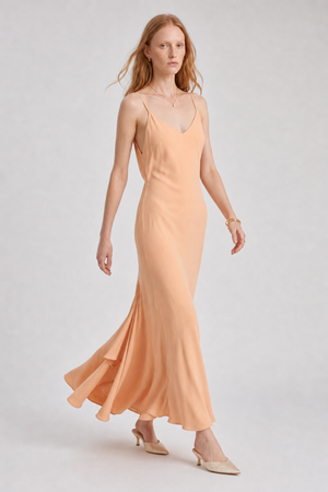 Vikki Maxi Dress by VKELLER in Orange Peach. 100% silk maxi dress with low back and flowing bias-cut silhouette. Designed in Paris, handcrafted in Portugal. #peach