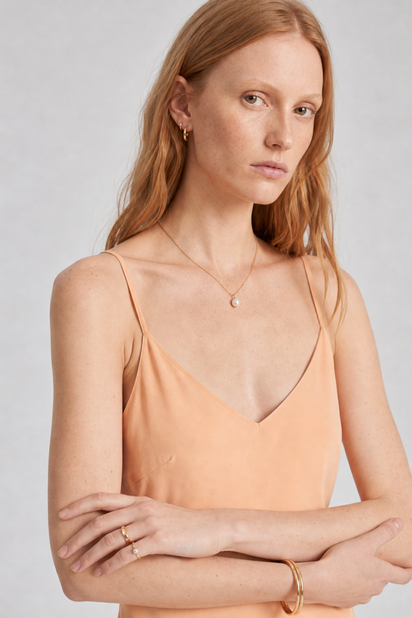 Vikki Maxi Dress by VKELLER in Orange Peach. 100% silk maxi dress with low back and flowing bias-cut silhouette. Designed in Paris, handcrafted in Portugal. #peach