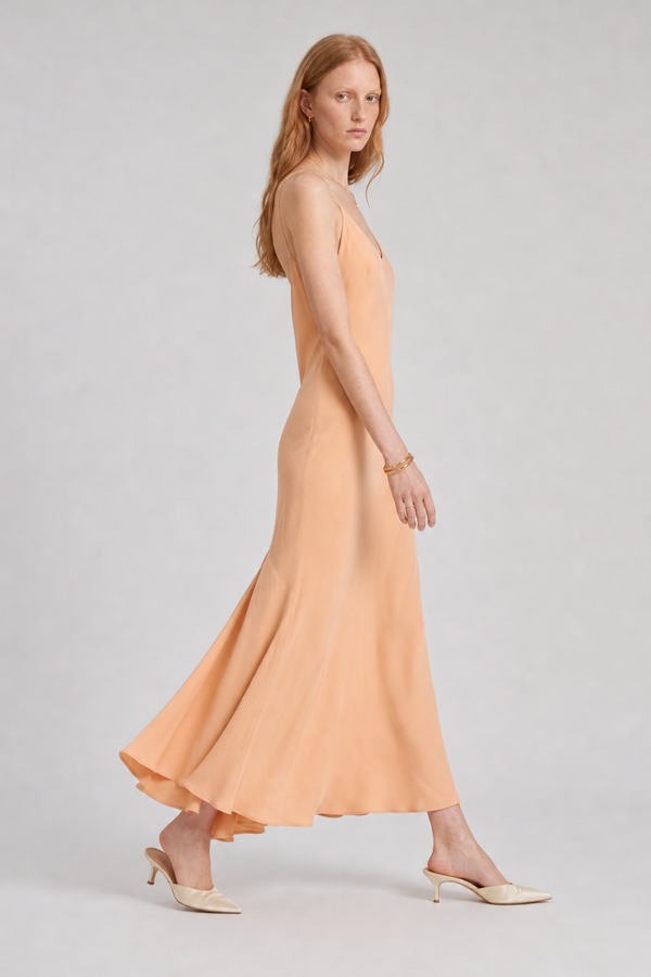 Vikki Maxi Dress by VKELLER in Orange Peach. 100% silk maxi dress with low back and flowing bias-cut silhouette. Designed in Paris, handcrafted in Portugal. #peach