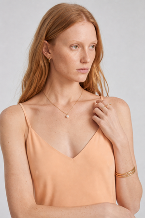Vikki Maxi Dress by VKELLER in Orange Peach. 100% silk maxi dress with low back and flowing bias-cut silhouette. Designed in Paris, handcrafted in Portugal. #peach